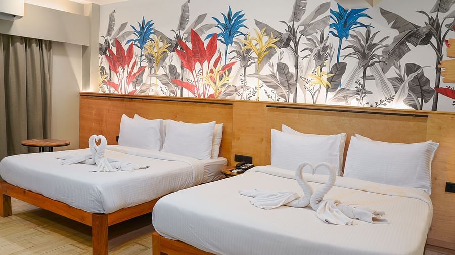 Two beds in Urban Corner Room at Indie Stays Resort, Goa.